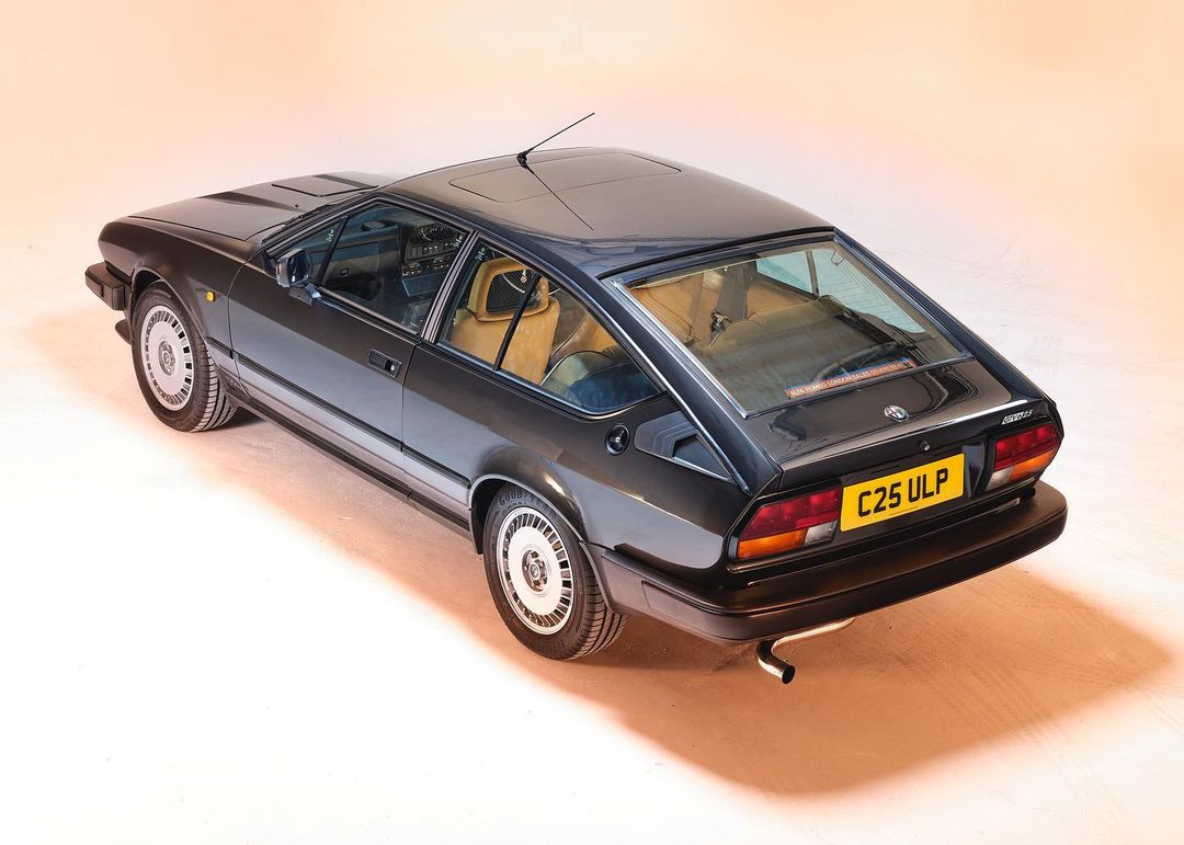 Rear three-quarter view of an Alfa Romeo photographed inside the studio