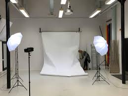 Photography studio hire with white backdrop, soft box lights, and professional studio space prepared for photoshoot